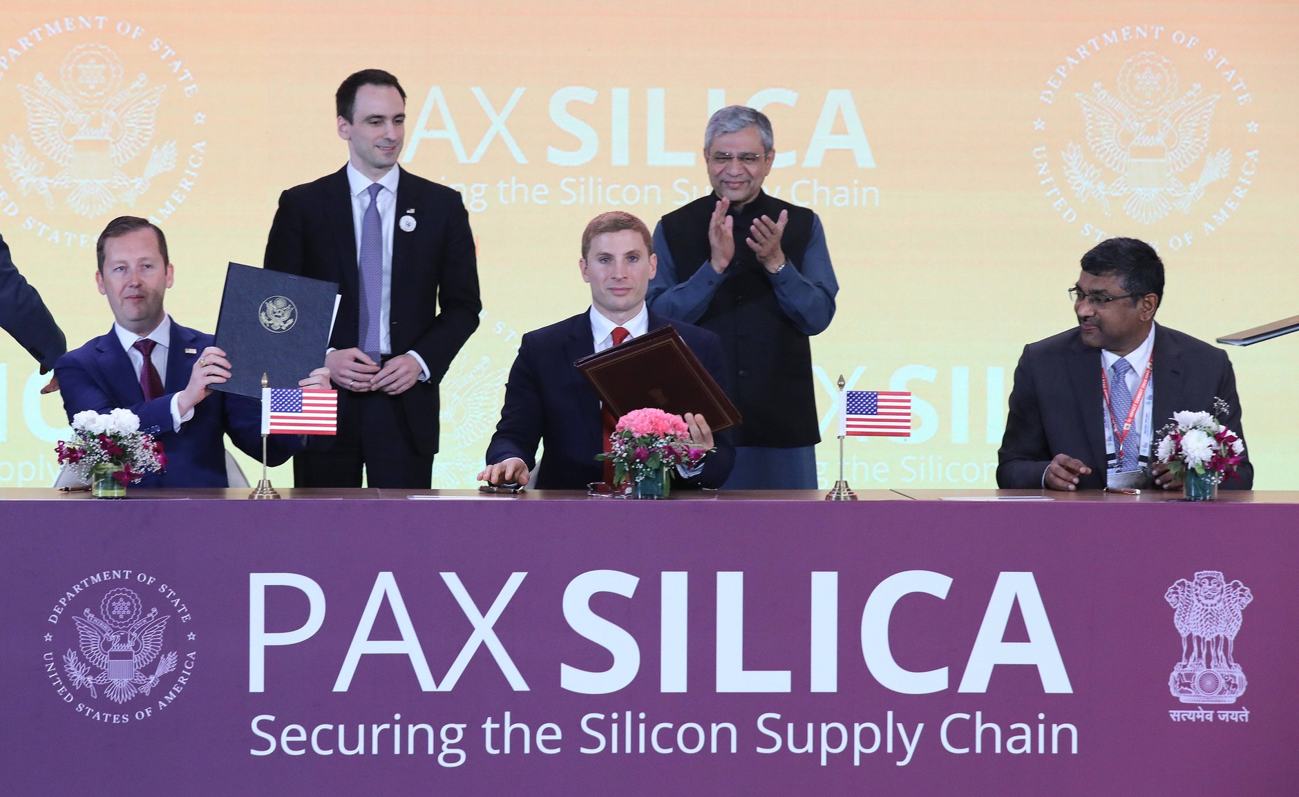 U.S. Ambassador to India Sergio Gor (L), Under Secretary of State for Economic Affairs Jacob Helberg (C), and Secretary of the Ministry of Electronics and Information Technology Sriram Krishnan (R) sign the Pax Silica declaration between the United States and India during the AI ​​Impact Summit 2026 in New Delhi, India, on February 20, 2026.