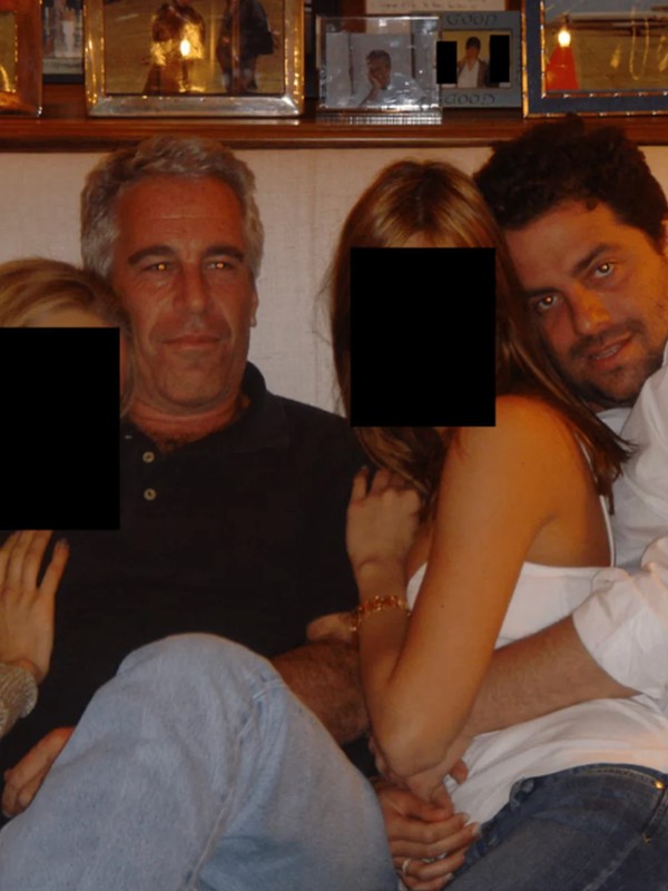 The undated photo released by the US Department of Justice shows Jeffrey Epstein and Brett Ratner in the company of two unknown young women