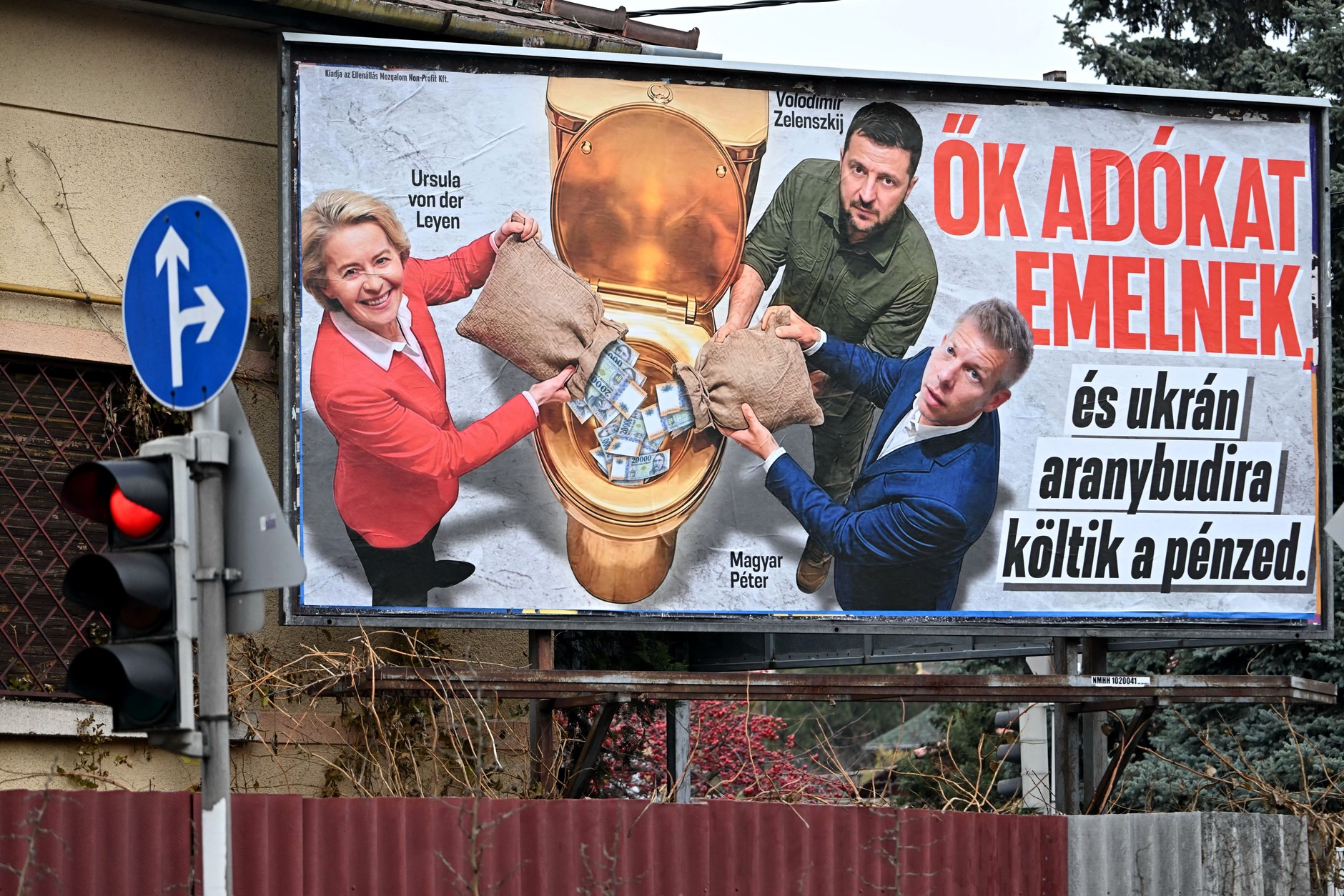 Billboard with images of the President of the European Commission Ursula von der Leyen, the President of Ukraine Volodymyr Zelensky and leader Tisza, with the caption: "They raise taxes and spend your money on a Ukrainian golden toilet"which was reportedly paid for by the National Resistance Movement, supporting Viktor Orban and Fidesz, on December 11, 2025.