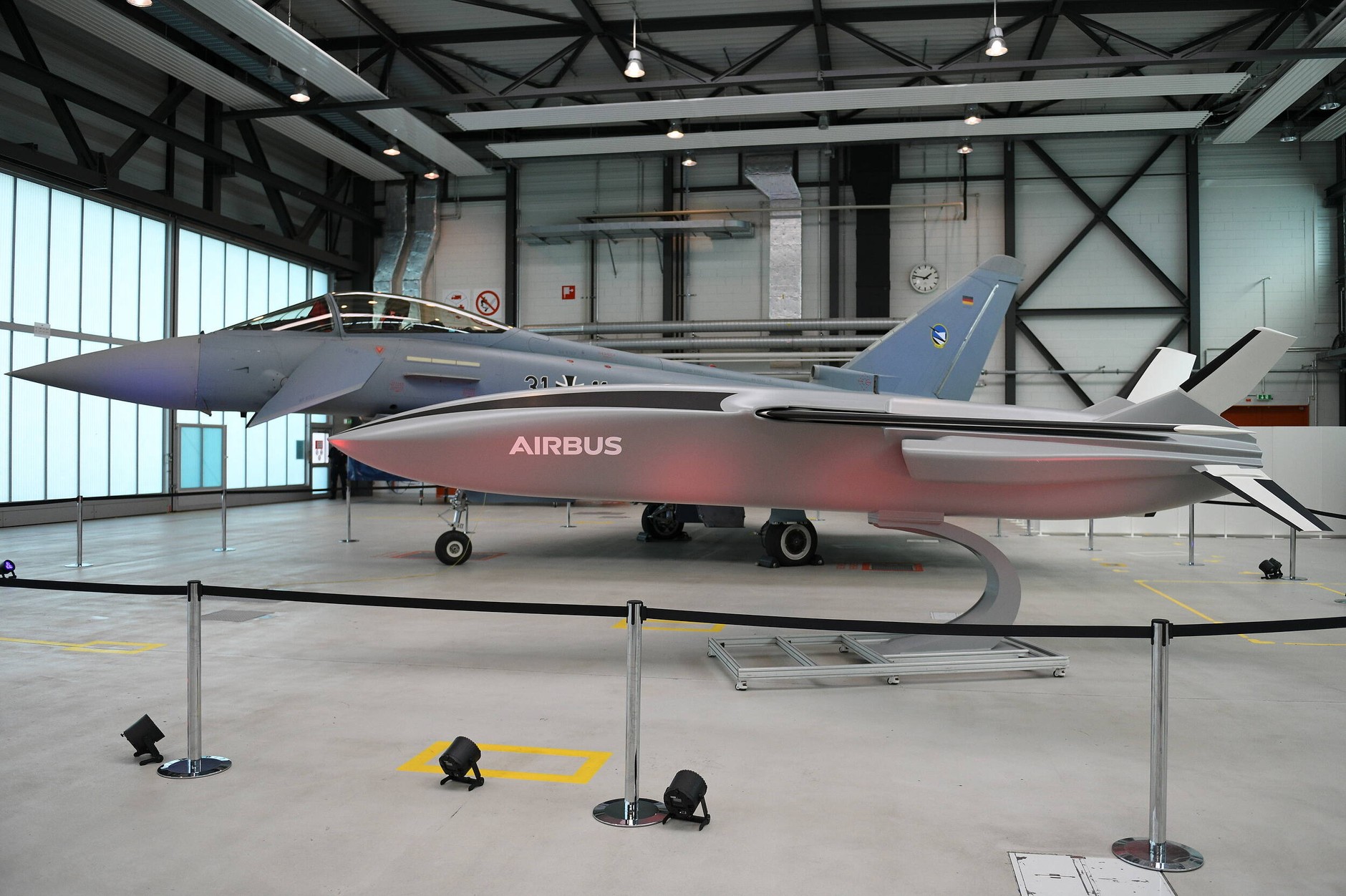 A model of a remotely controlled transport drone and Eurofighter aircraft displayed in the hangar during the visit of German and French representatives of the Ministry of Defense. Manching, September 17, 2020
