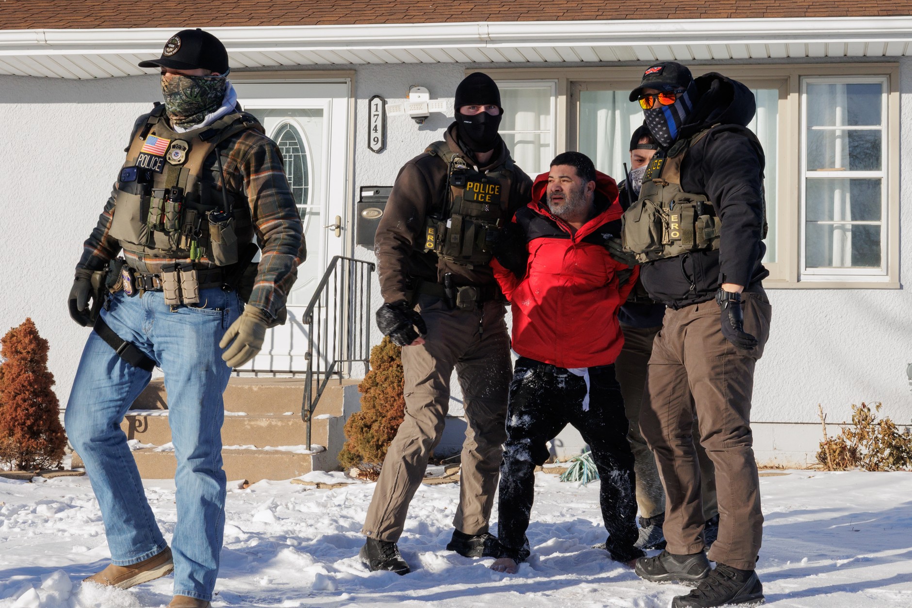 ICE agents arrest a man outside his home during an operation in St. Paul, Minnesota, January 27, 2026 