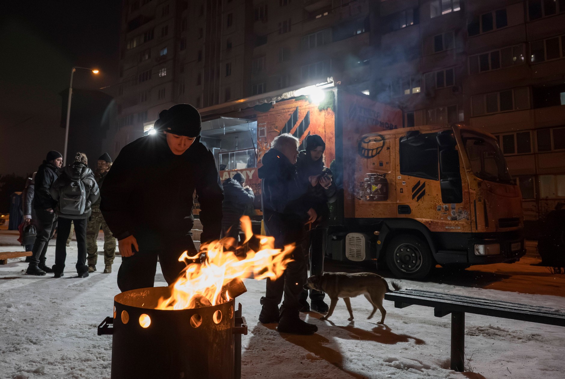 Residents of Kiev warm themselves around a makeshift fire, Ukraine, January 28, 2026.
