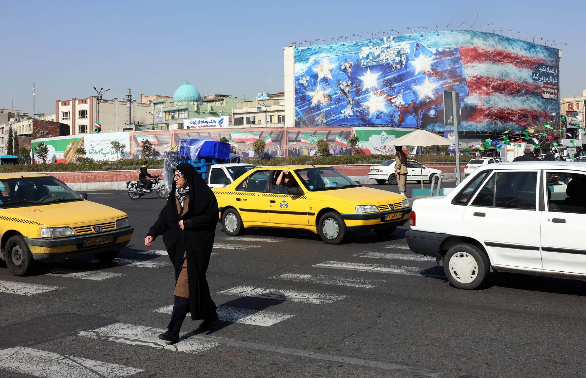 Street in Tehran. An anti-American billboard in the background