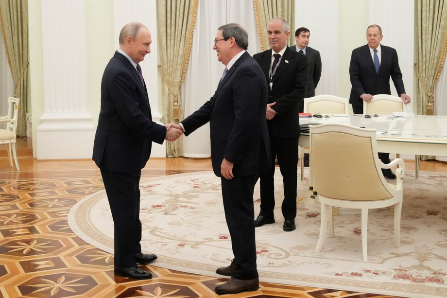 Russian President Vladimir Putin greets Cuban Foreign Minister Bruno Rodriguez Parrilla during a meeting at the Kremlin in Moscow, Russia, February 18, 2026.