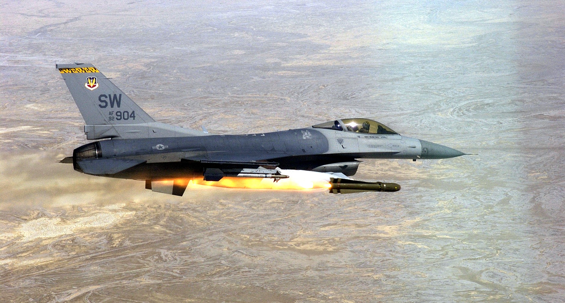 The photo shows an F-16CJ fighter
