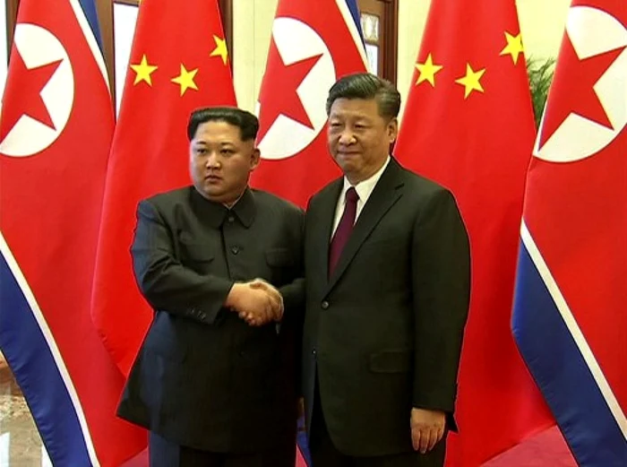 Km Jong-un and Xi Jinping close ranks/PHOTO:AFP