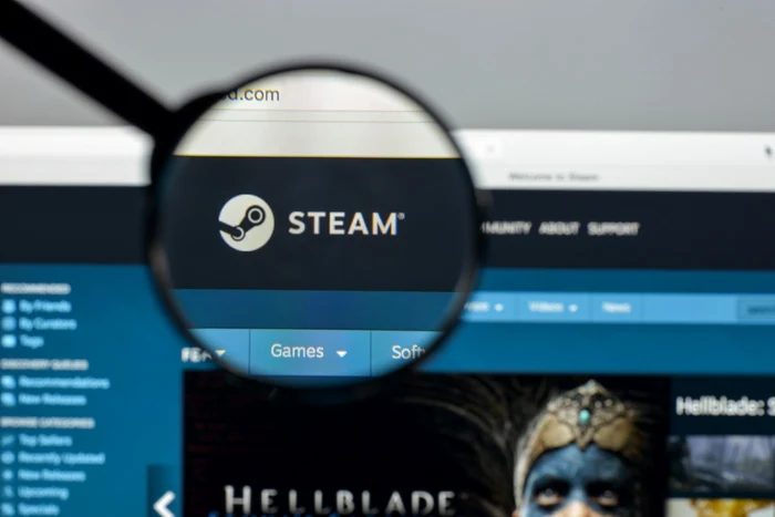 Magnifying glass on the word Steam on a platform