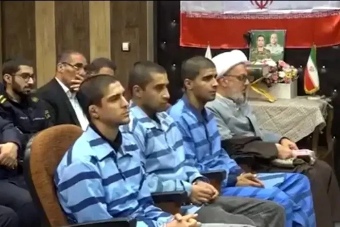 The athlete (right), together with the others sentenced to death. Photo X