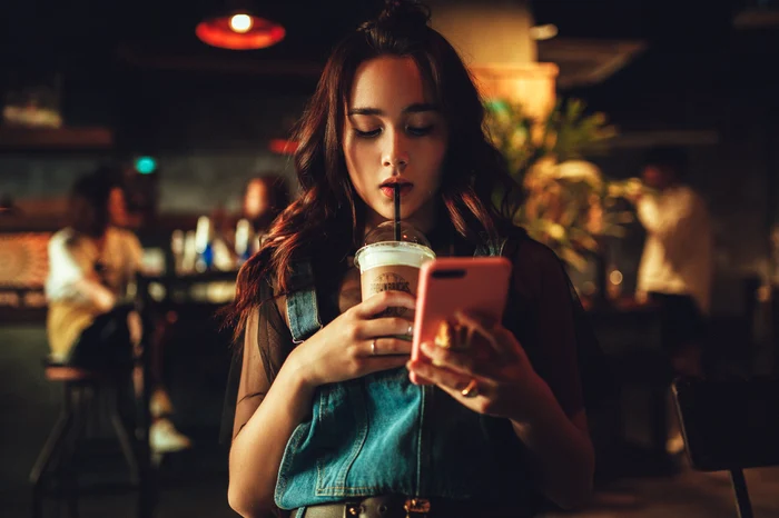 woman with phone in hand