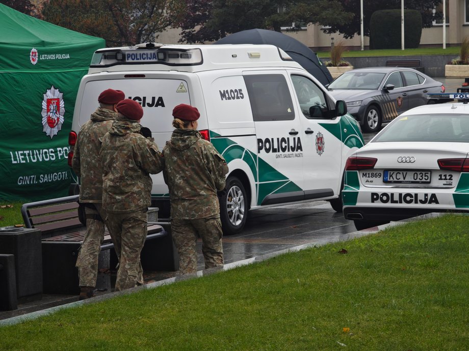 Soldiers and police cars at a picnic in a Lithuanian city