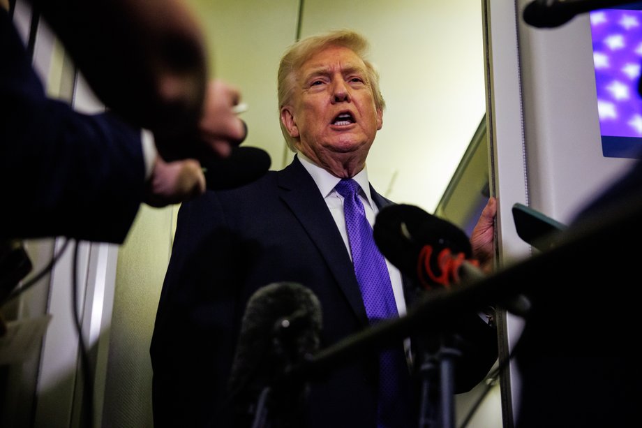 Donald Trump after signing the waiver of additional tariffs on India aboard Air Force One en route to Palm Beach, Florida. The president will spend the weekend at Mar-a-Lago, his private club.