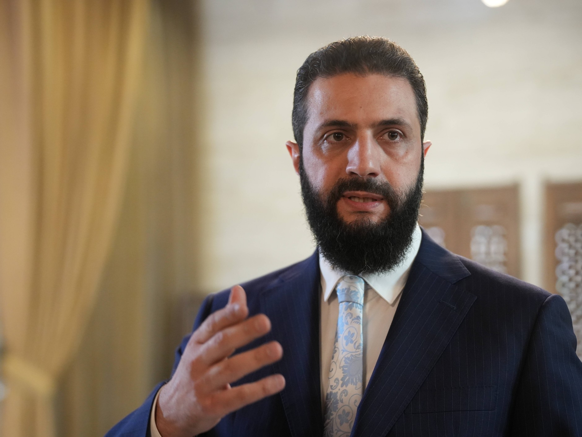 Syrian President Ahmed al-Shara after signing the agreement at the presidential palace in Damascus, Syria, January 18, 2026.
