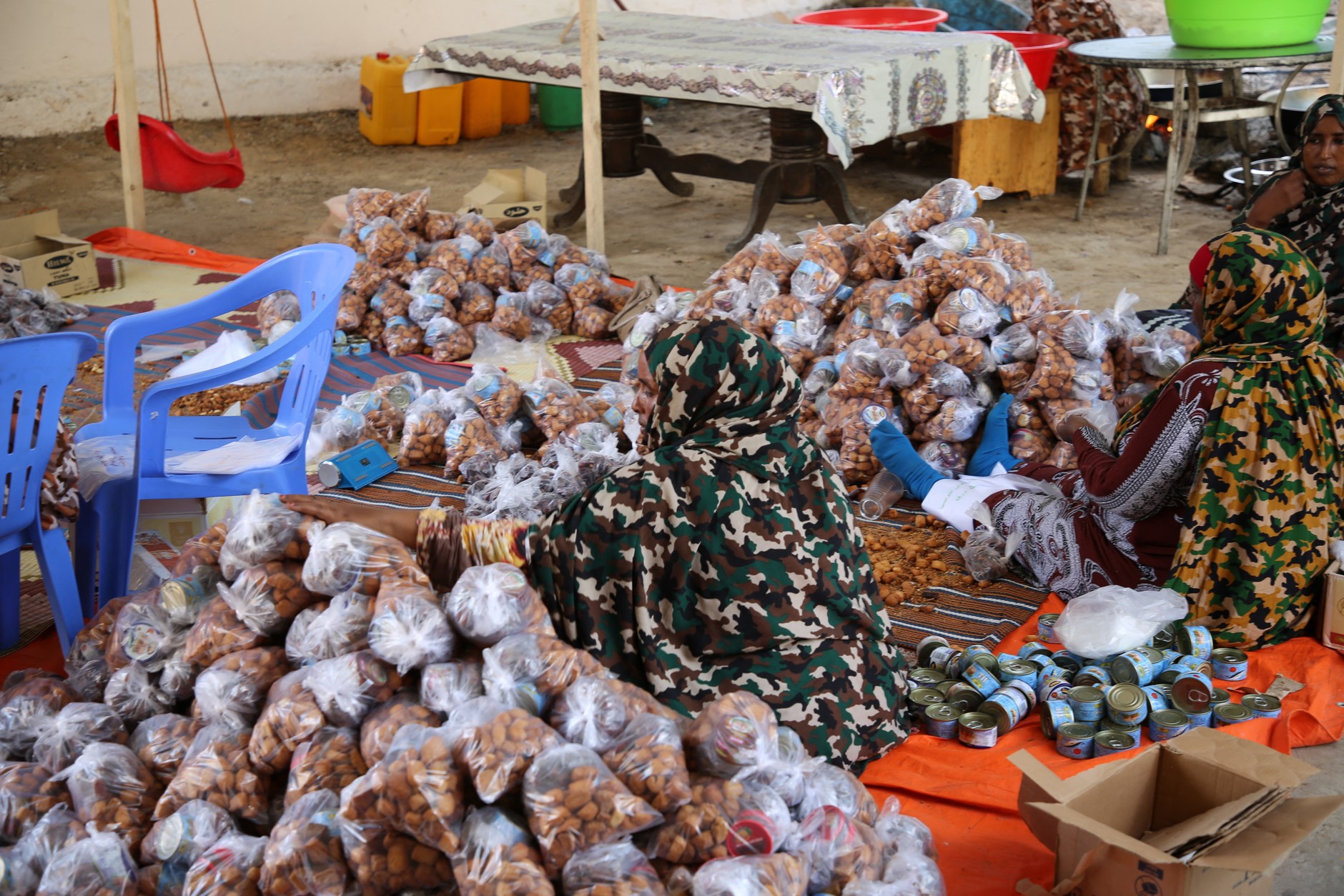 Women producing dried food products for sale to support government military operations against the Al-Shabaab terrorist group, Mogadishu, Somalia, September 11, 2023.