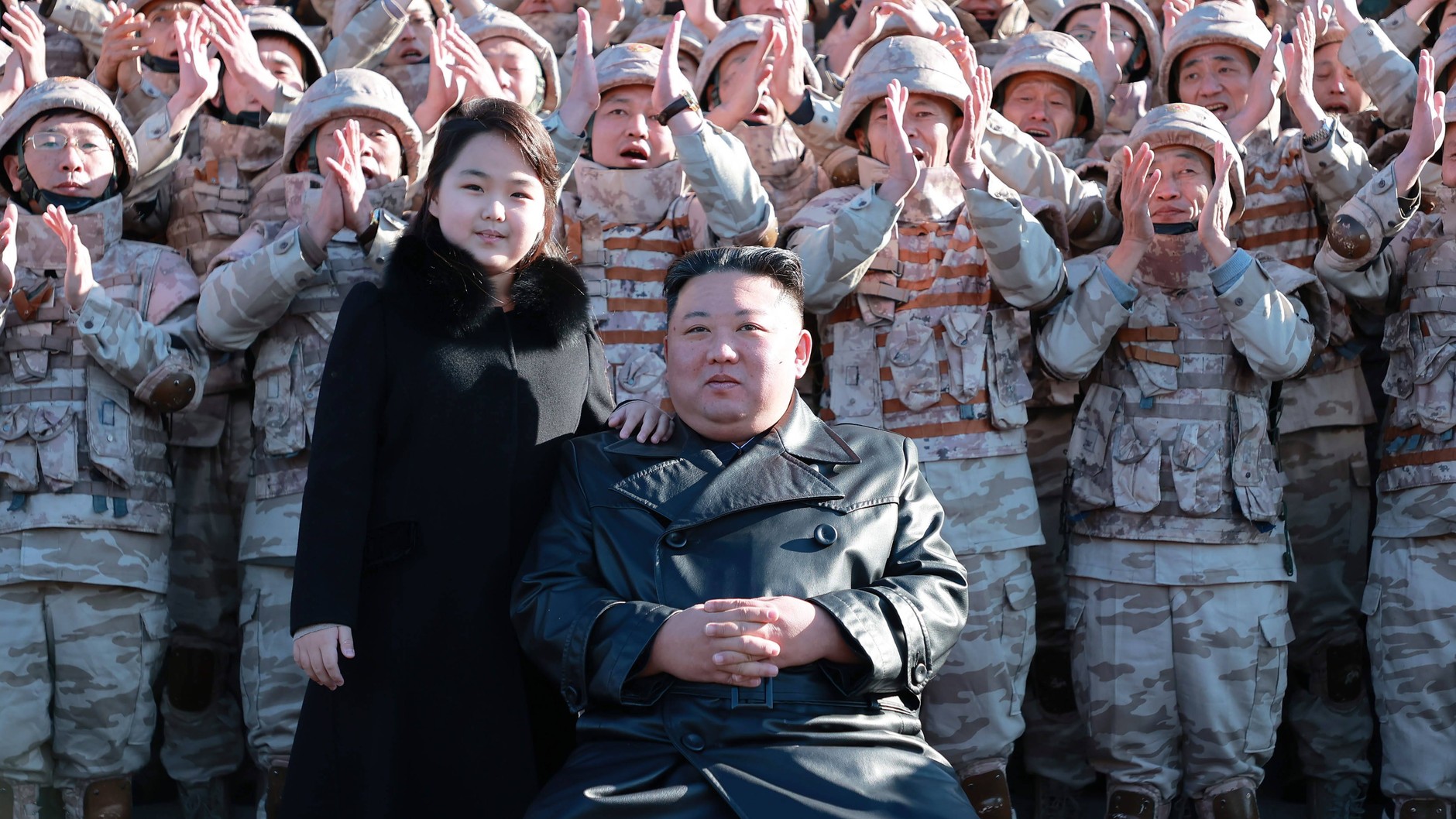 Kim Ju Ae and Kim Jong Un during a photo session with participants of a successful ballistic missile test, November 27, 2022.