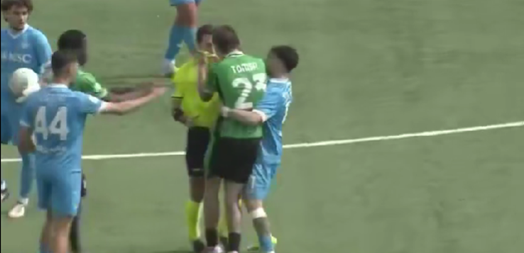 Junior international Troy Tomșa is sent off and puts his hands around the referee's neck