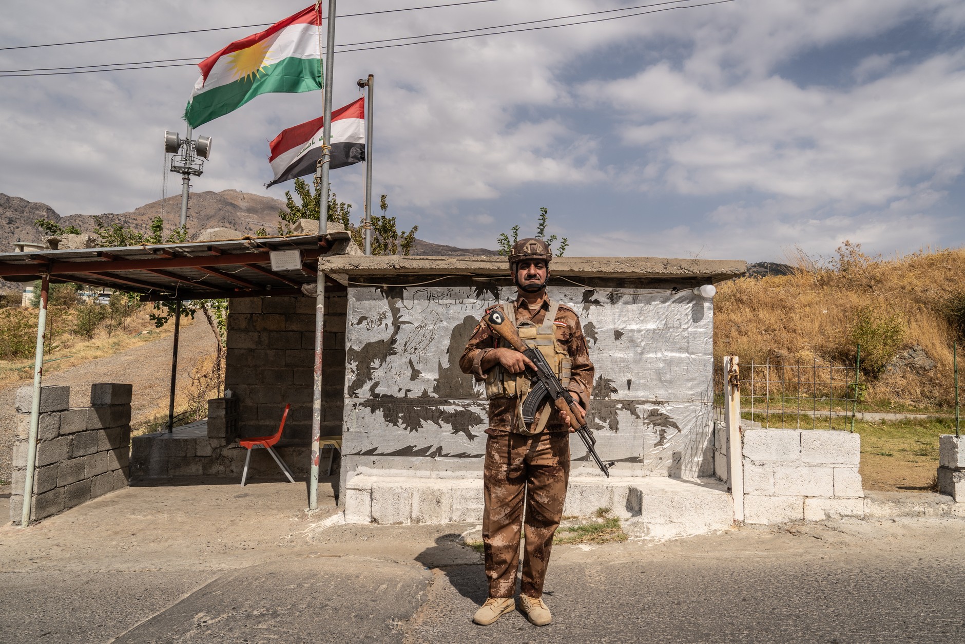 A Kurdish fighter guards a checkpoint on the border with Iran in the mountainous northern Kurdistan region, September 30, 2024.