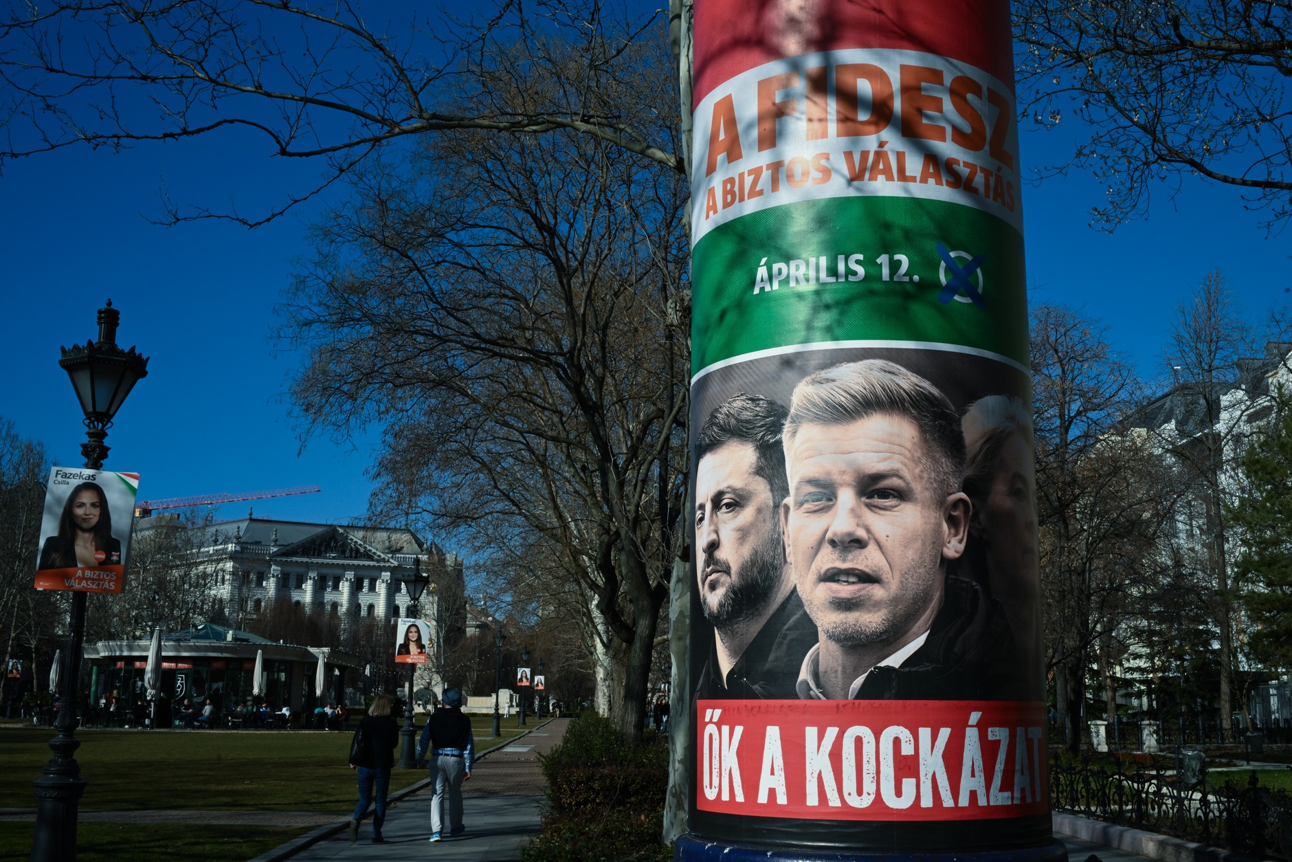 An election poster of the Hungarian ruling party Fidesz, depicting Ukrainian President Volodymyr Zelensky, opposition politician Peter Magyar and European Commission President Ursula von der Leyen, displayed on a street in Budapest, March 5, 2026. 
