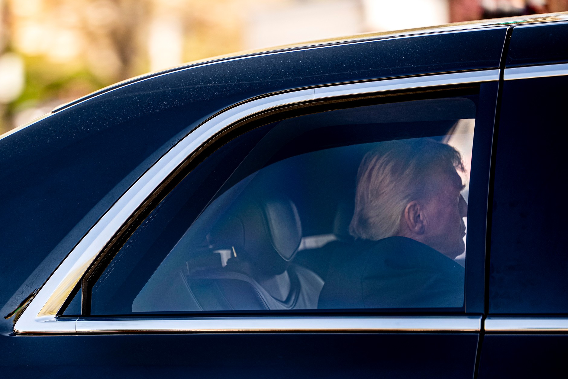 Donald Trump leaves in the presidential limousine after attending a Supreme Court hearing, April 1, 2026. 