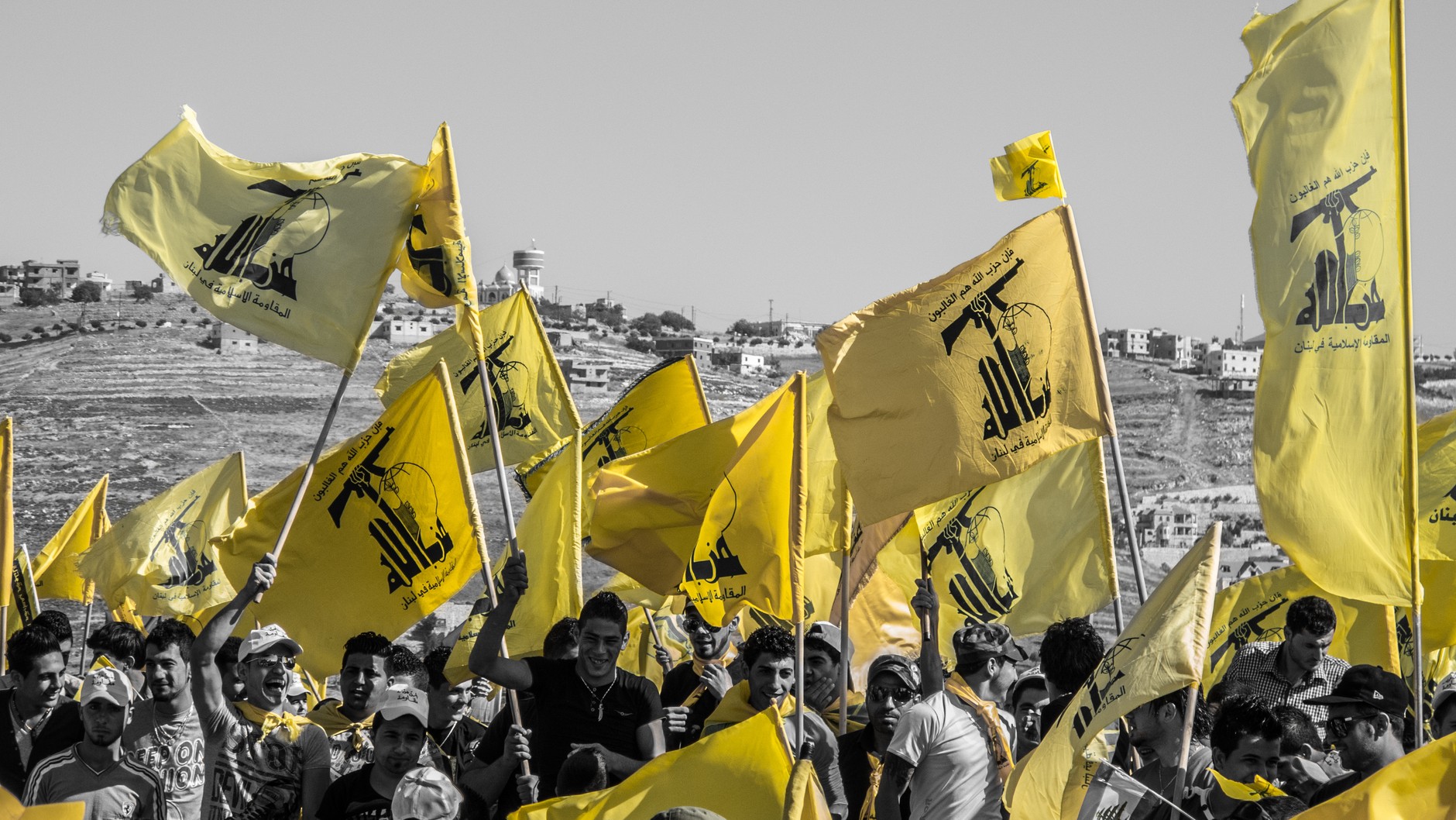 Hezbollah supporters with militia flags. Illustrative photo