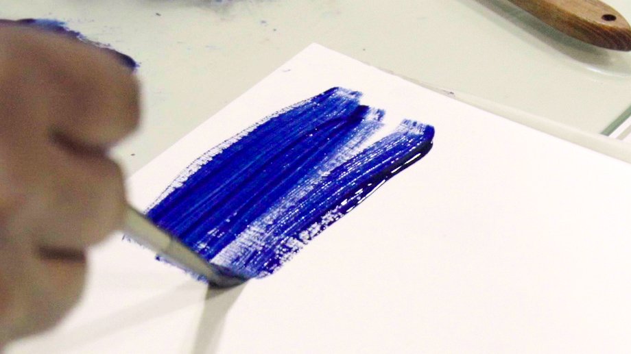 To transform the pigment into paint, Mohammad mixes it with oil