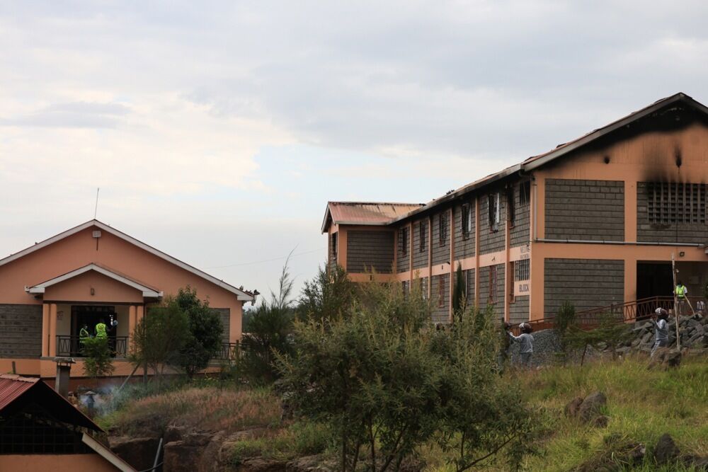 They jumped out of windows and from balconies. At least 16 people have died in a fire at a dormitory in Kenya.