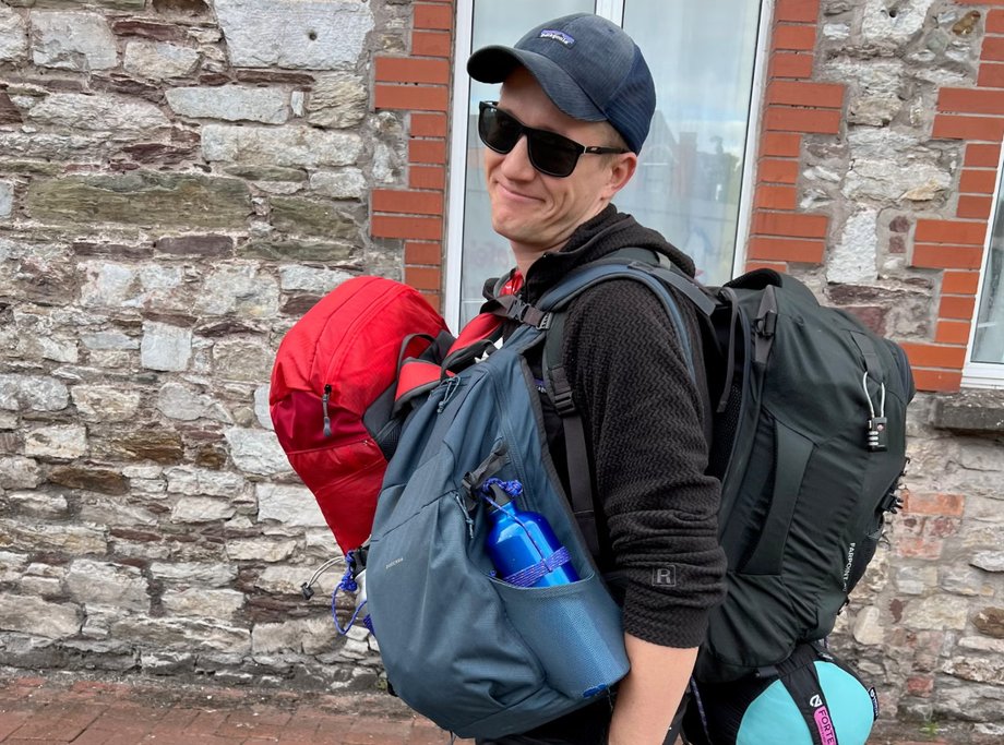 Her husband helped her carry all her bags because she developed back problems
