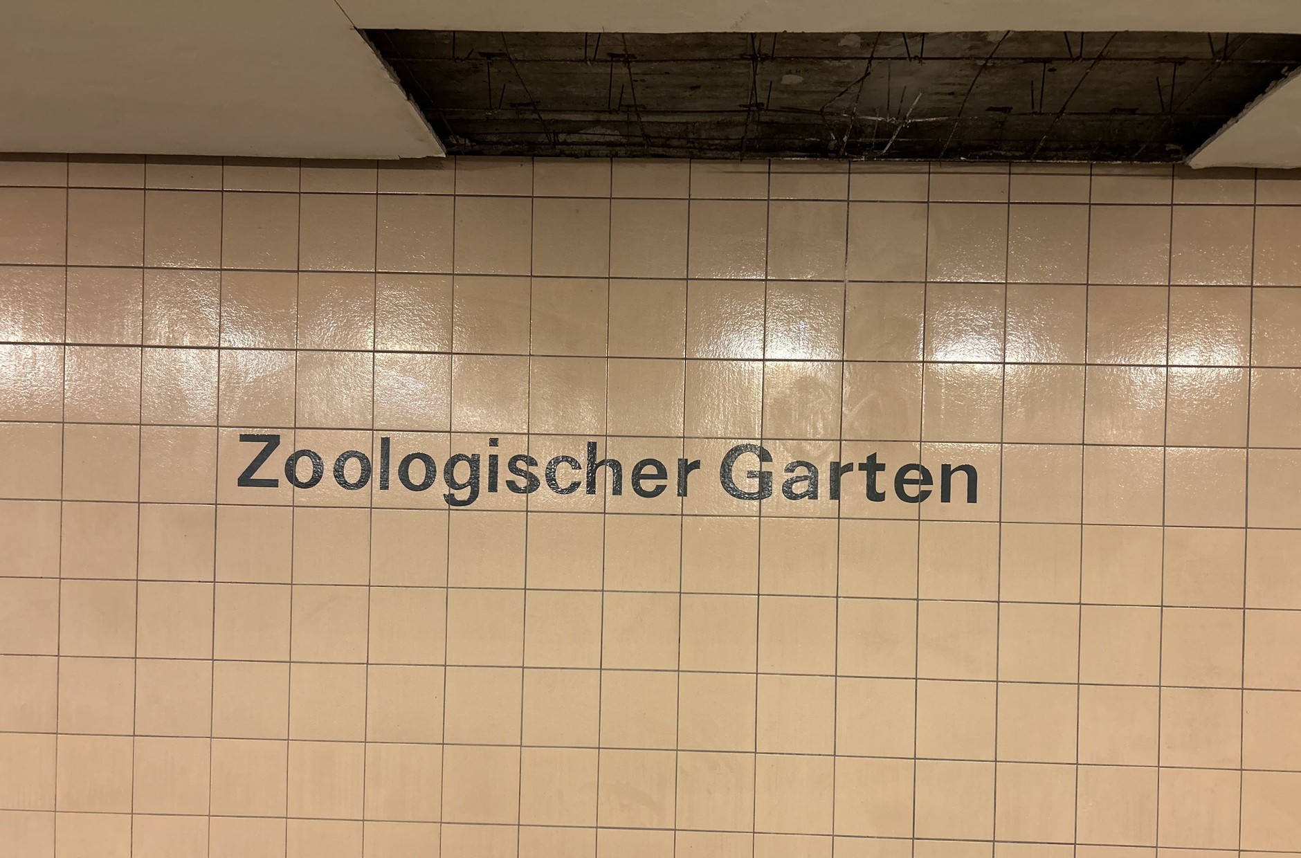 The inscription on the subway wall at the Zoo Station