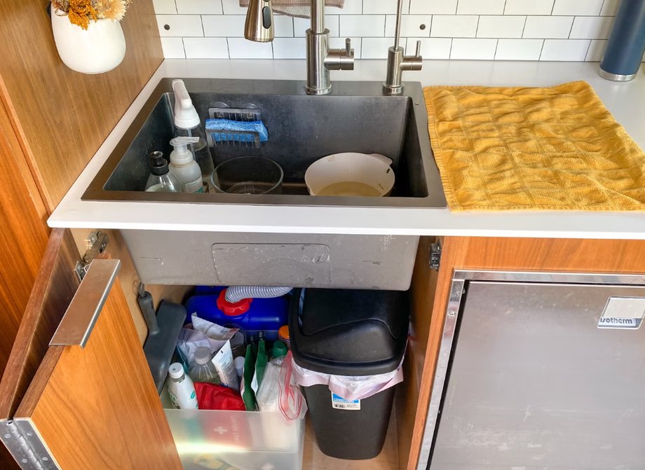One of the challenges of living in a van is having to brush your teeth using the kitchen sink